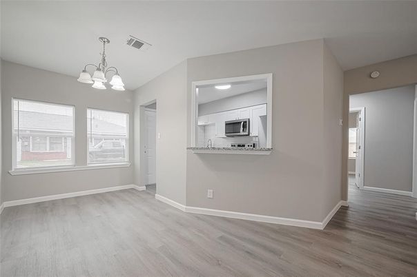 Chandelier, Empty room, Interior, Kitchen, Recessed Lighting, Stainless Steel Appliances, Wood Texture Flooring
