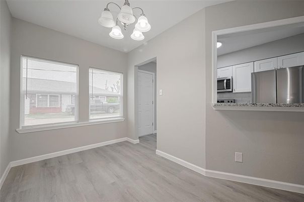 Empty room, Interior, Kitchen, Stainless Steel Appliances, Wood Texture Flooring