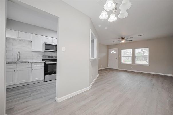 Empty room, Interior, Kitchen, Stainless Steel Appliances, Wood Texture Flooring