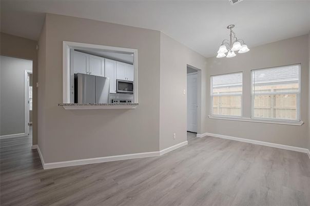 Chandelier, Empty room, Interior, Kitchen, Pendant Lights, Stainless Steel Appliances, Wood Texture Flooring