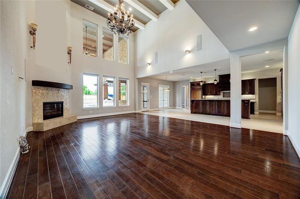 Chandelier, Empty room, Fireplace, Interior, Kitchen, Pendant Lights, Recessed Lighting, Wood Texture Flooring