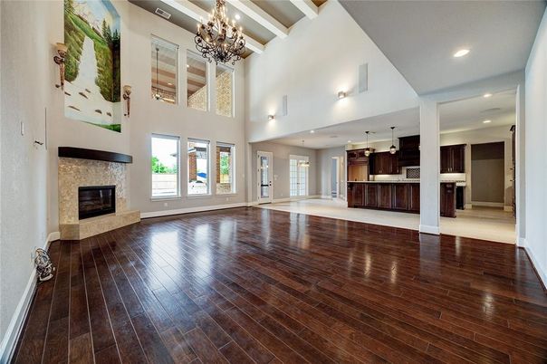 Chandelier, Empty room, Fireplace, Interior, Kitchen, Pendant Lights, Recessed Lighting, Wood Texture Flooring