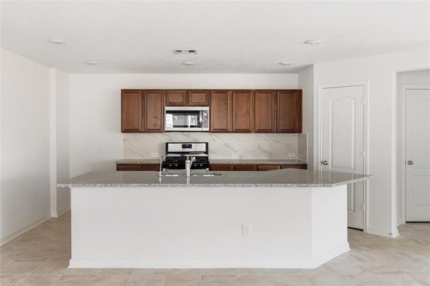 Interior, Kitchen, Marble Walls, Recessed Lighting, Stainless Steel Appliances