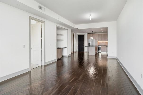 Empty room, Interior, Kitchen, Pendant Lights, Recessed Lighting, Stainless Steel Appliances, Wood Texture Flooring