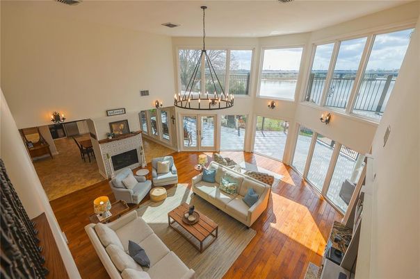 Chandelier, Dining room, Fireplace, Interior, Living room, Pendant Lights, Water, Wood Texture Flooring