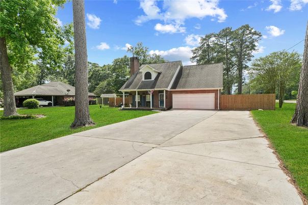 Attached, Backyard, Exterior, Facade, Brick Facade, Cape Cod