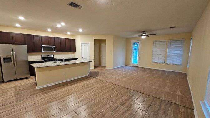 Interior, Kitchen, Recessed Lighting, Stainless Steel Appliances, Wood Texture Flooring