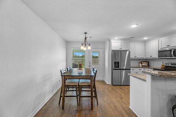 Dining room, Interior, Kitchen, Pendant Lights, Recessed Lighting, Stainless Steel Appliances, Wood Texture Flooring