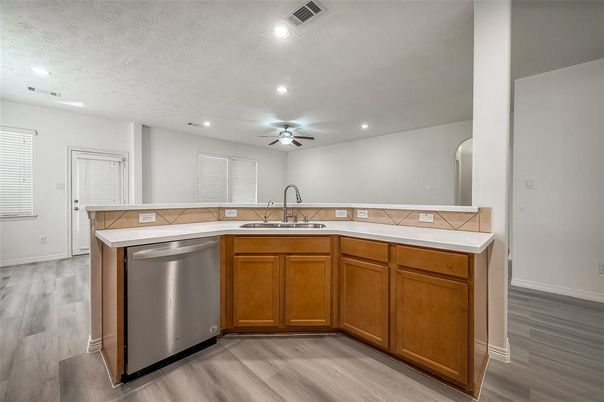 Interior, Kitchen, Recessed Lighting, Tile Countertops, Wood Texture Flooring