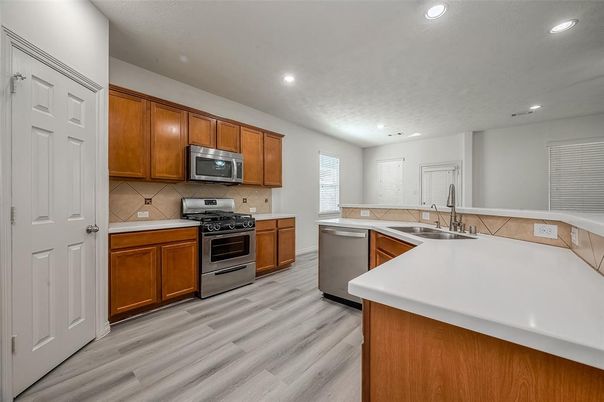 Interior, Kitchen, Recessed Lighting, Stainless Steel Appliances, Wood Texture Flooring