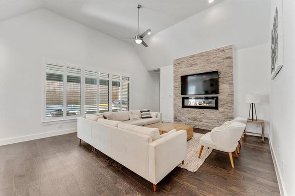 Fireplace, Interior, Living room, Recessed Lighting, Stone Walls, Wood Texture Flooring