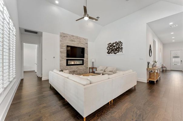 Fireplace, Interior, Living room, Recessed Lighting, Stone Walls, Wood Texture Flooring