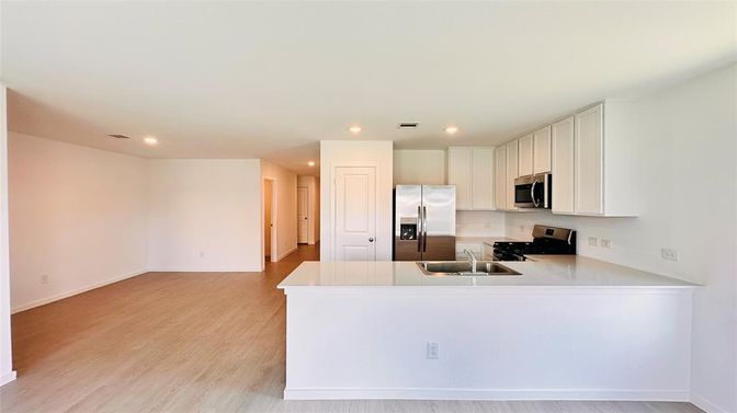 Interior, Kitchen, Recessed Lighting, Stainless Steel Appliances, Wood Texture Flooring