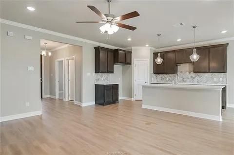 Empty room, Fireplace, Interior, Kitchen, Pendant Lights, Recessed Lighting, Wood Texture Flooring