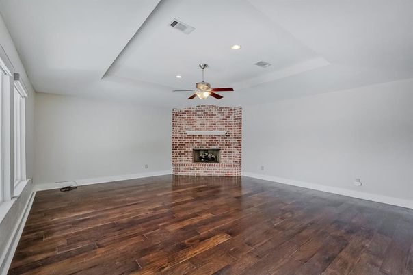 Empty room, Fireplace, Interior, Recessed Lighting, Stone Walls, Wood Texture Flooring