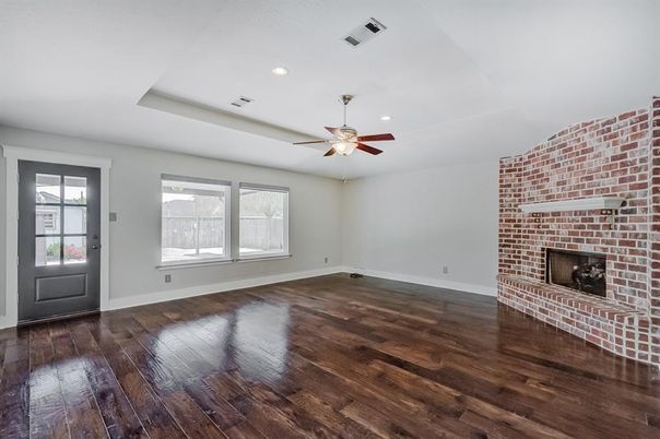 Empty room, Fireplace, Interior, Recessed Lighting, Stone Walls, Wood Texture Flooring