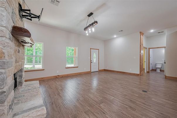 Empty room, Fireplace, Interior, Pendant Lights, Recessed Lighting, Wood Texture Flooring