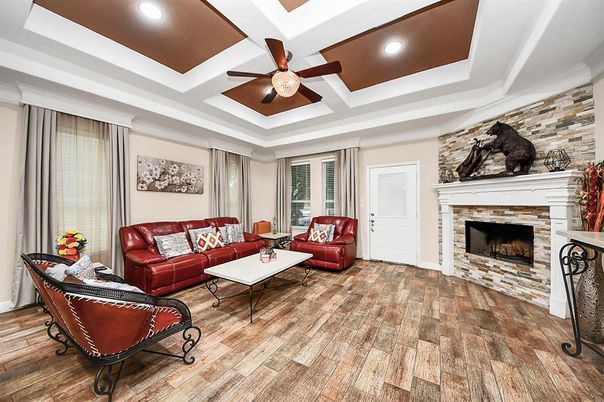 Fireplace, Interior, Living room, Recessed Lighting, Stone Walls, Wood Texture Flooring