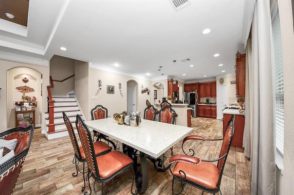 Dining room, Interior, Kitchen, Pendant Lights, Recessed Lighting, Stainless Steel Appliances, Wood Texture Flooring