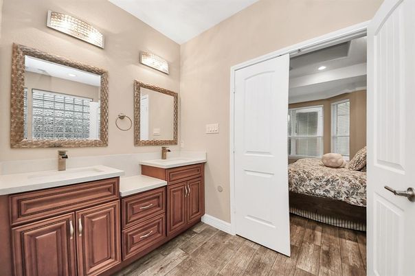 Bathroom, Dual Sink Vanities, Interior, Recessed Lighting, Wood Texture Flooring