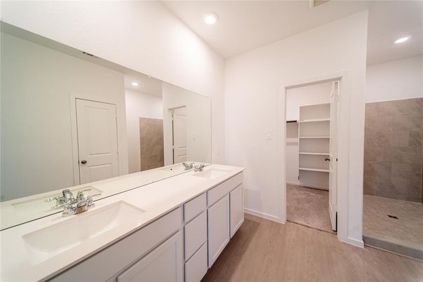 Bathroom, Dual Sink Vanities, Interior, Recessed Lighting, Walk-in Closets, Wood Texture Flooring