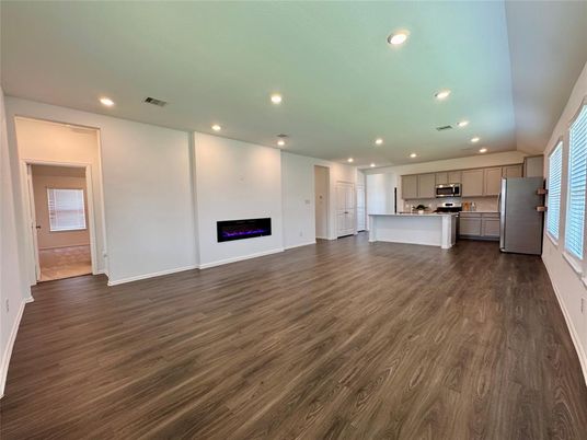 Empty room, Interior, Kitchen, Recessed Lighting, Stainless Steel Appliances, Wood Texture Flooring