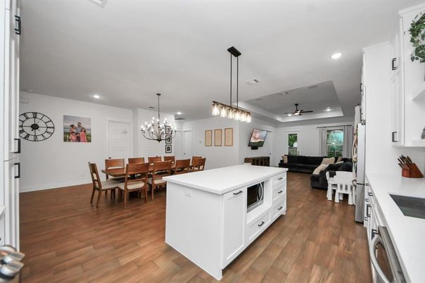 Chandelier, Dining room, Interior, Kitchen, Living room, Pendant Lights, Recessed Lighting, Wood Texture Flooring