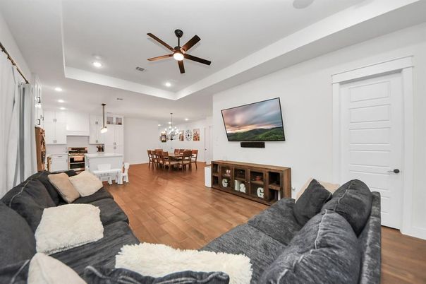 Chandelier, Dining room, Interior, Kitchen, Living room, Pendant Lights, Recessed Lighting, Stainless Steel Appliances, Wood Texture Flooring