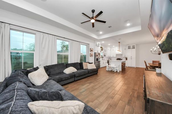 Chandelier, Dining room, Interior, Kitchen, Living room, Pendant Lights, Recessed Lighting, Stainless Steel Appliances, Wood Texture Flooring