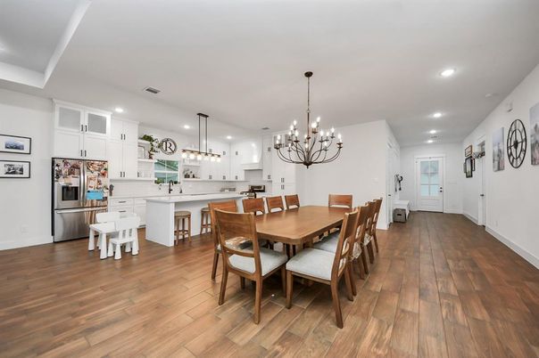 Chandelier, Dining room, Interior, Kitchen, Pendant Lights, Recessed Lighting, Stainless Steel Appliances, Wood Texture Flooring