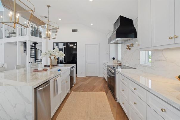 Interior, Kitchen, Marble Walls, Pendant Lights, Recessed Lighting, Stainless Steel Appliances, Wood Texture Flooring