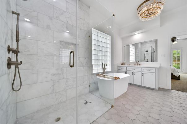 Bathroom, Chandelier, Dual Sink Vanities, Free Standing Baths, Glass Shower, Interior, Marble Walls, Recessed Lighting
