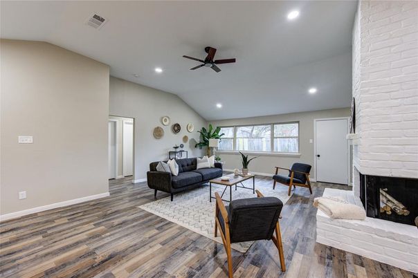 Fireplace, Interior, Living room, Recessed Lighting, Stone Walls, Wood Texture Flooring