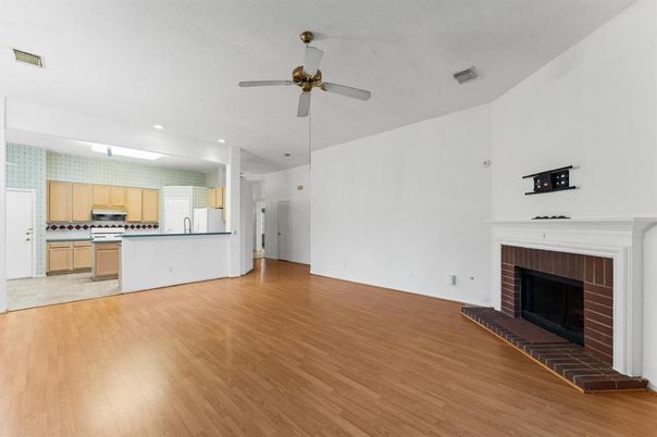 Empty room, Fireplace, Interior, Kitchen, Recessed Lighting, Wood Texture Flooring