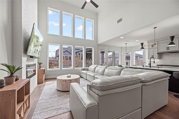 Fireplace, Interior, Kitchen, Living room, Pendant Lights, Recessed Lighting, Stainless Steel Appliances, Wood Texture Flooring