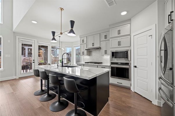 Interior, Kitchen, Pendant Lights, Recessed Lighting, Stainless Steel Appliances, Wood Texture Flooring