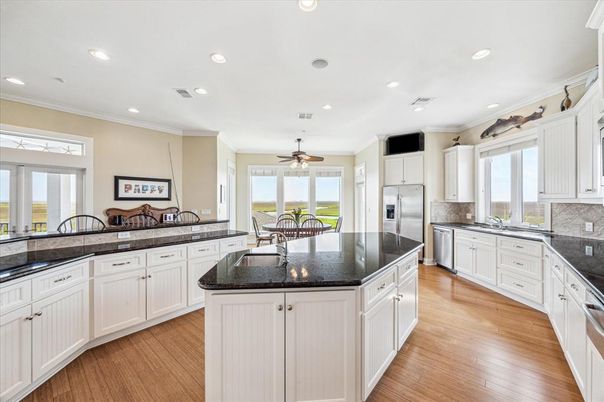Dining room, Interior, Kitchen, Recessed Lighting, Stainless Steel Appliances, Wood Texture Flooring