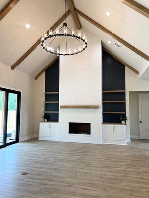 Chandelier, Empty room, Fireplace, Interior, Pendant Lights, Recessed Lighting, Wooden Beams, Wood Texture Flooring