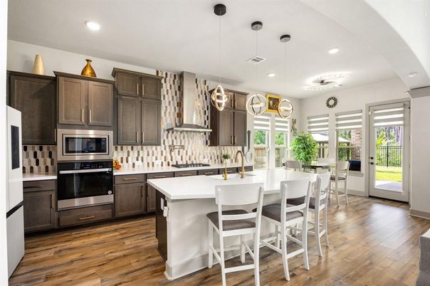 Dining room, Interior, Kitchen, Pendant Lights, Recessed Lighting, Stainless Steel Appliances, Wood Texture Flooring