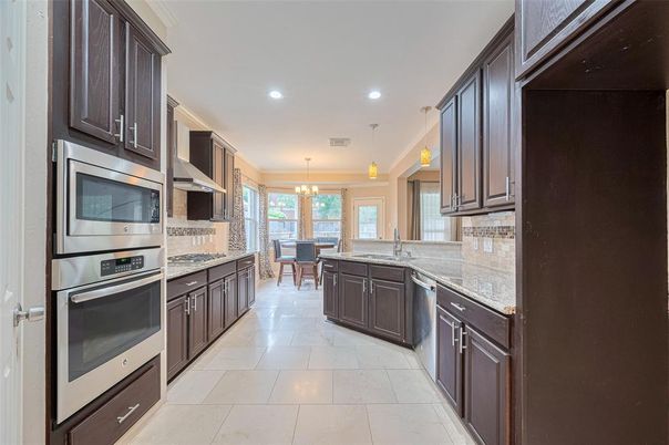 Chandelier, Dining room, Interior, Kitchen, Pendant Lights, Recessed Lighting, Stainless Steel Appliances