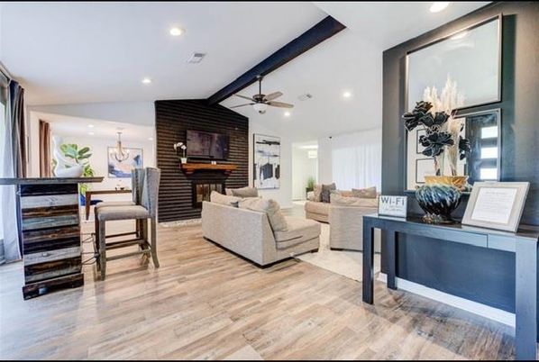 Chandelier, Dining room, Fireplace, Interior, Living room, Pendant Lights, Recessed Lighting, Wood Texture Flooring, Wooden Walls