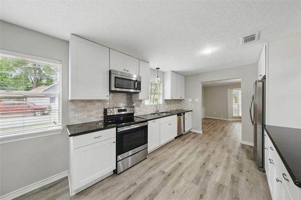 Interior, Kitchen, Pendant Lights, Recessed Lighting, Stainless Steel Appliances, Wood Texture Flooring