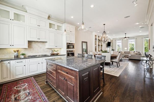 Chandelier, Dining room, Interior, Kitchen, Living room, Pendant Lights, Recessed Lighting, Stainless Steel Appliances, Wood Texture Flooring