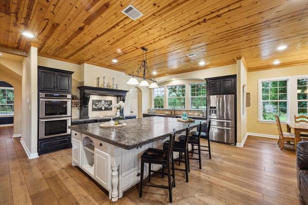 Dining room, Interior, Kitchen, Pendant Lights, Recessed Lighting, Stainless Steel Appliances, Wooden Ceilings, Wood Texture Flooring