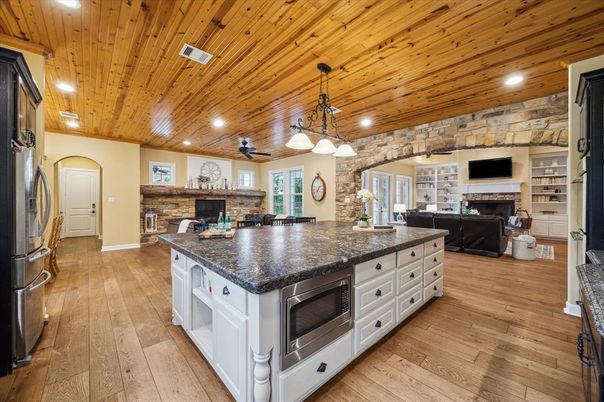 Fireplace, Interior, Kitchen, Living room, Pendant Lights, Recessed Lighting, Stone Walls, Wooden Ceilings, Wood Texture Flooring