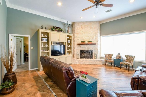 Fireplace, Interior, Living room, Recessed Lighting, Stone Walls, Wood Texture Flooring