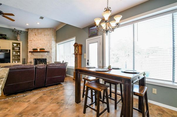 Chandelier, Dining room, Fireplace, Interior, Living room, Recessed Lighting, Stone Walls