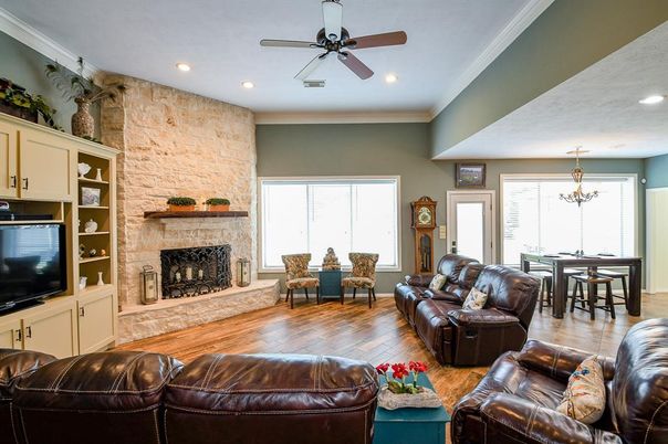 Chandelier, Dining room, Fireplace, Interior, Living room, Recessed Lighting, Stone Walls, Wood Texture Flooring