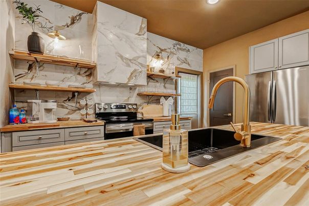 Interior, Kitchen, Marble Walls, Recessed Lighting, Stainless Steel Appliances