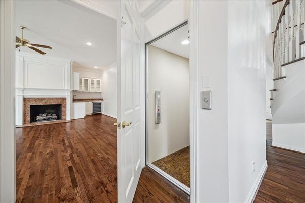 Elevator, Fireplace, Interior, Recessed Lighting, Wood Texture Flooring